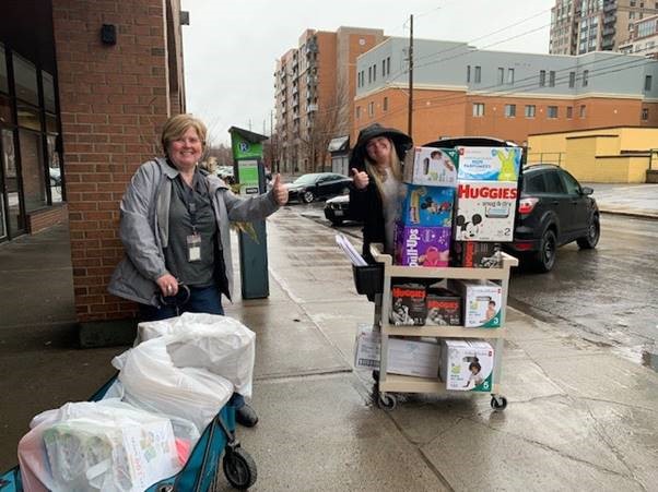Centretown CHC: Jennifer and Vanessa loading up supplies to bring to families living in a shelter