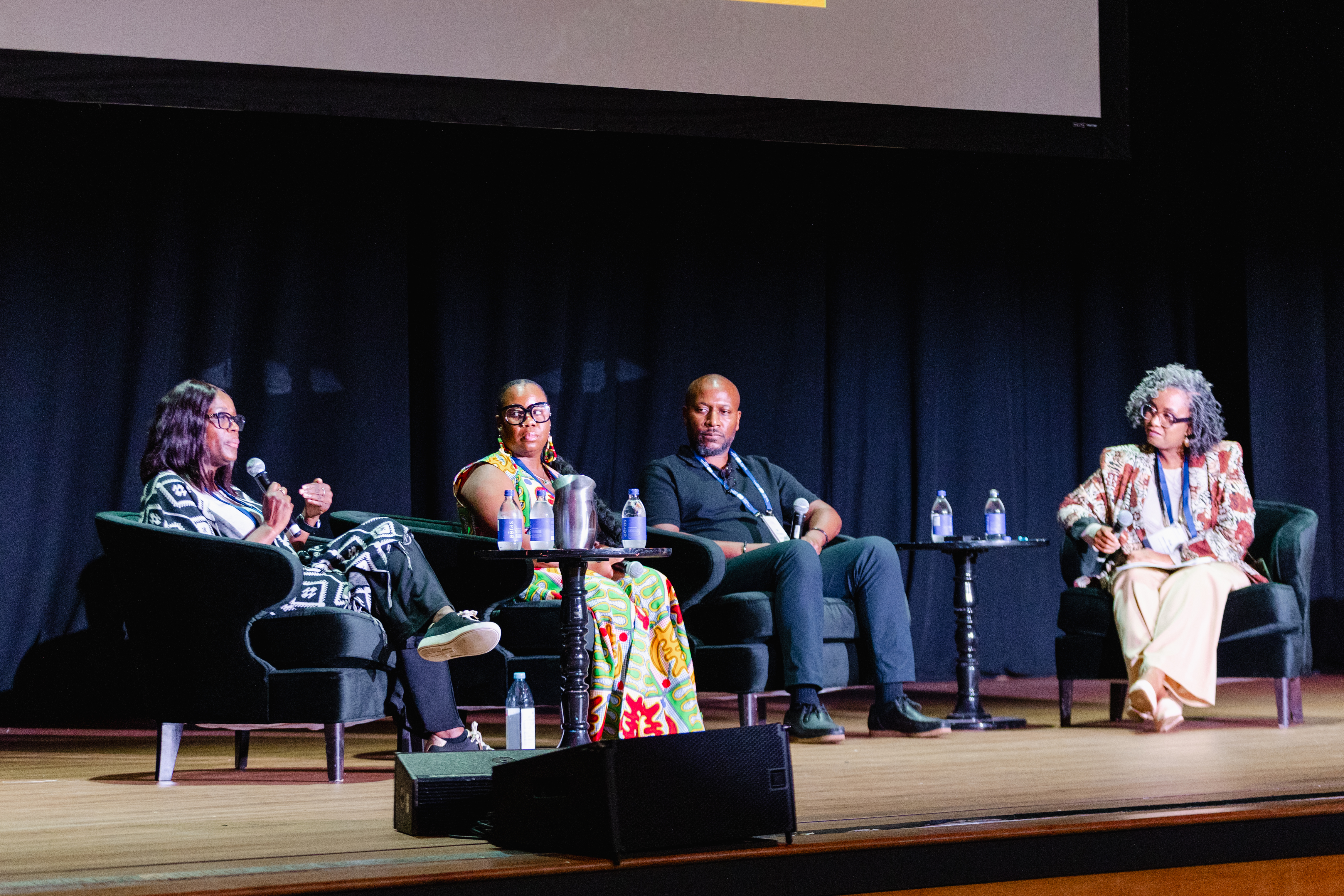 Photograph shows a panel of Black-Focused Social Prescribing Experts at a live event