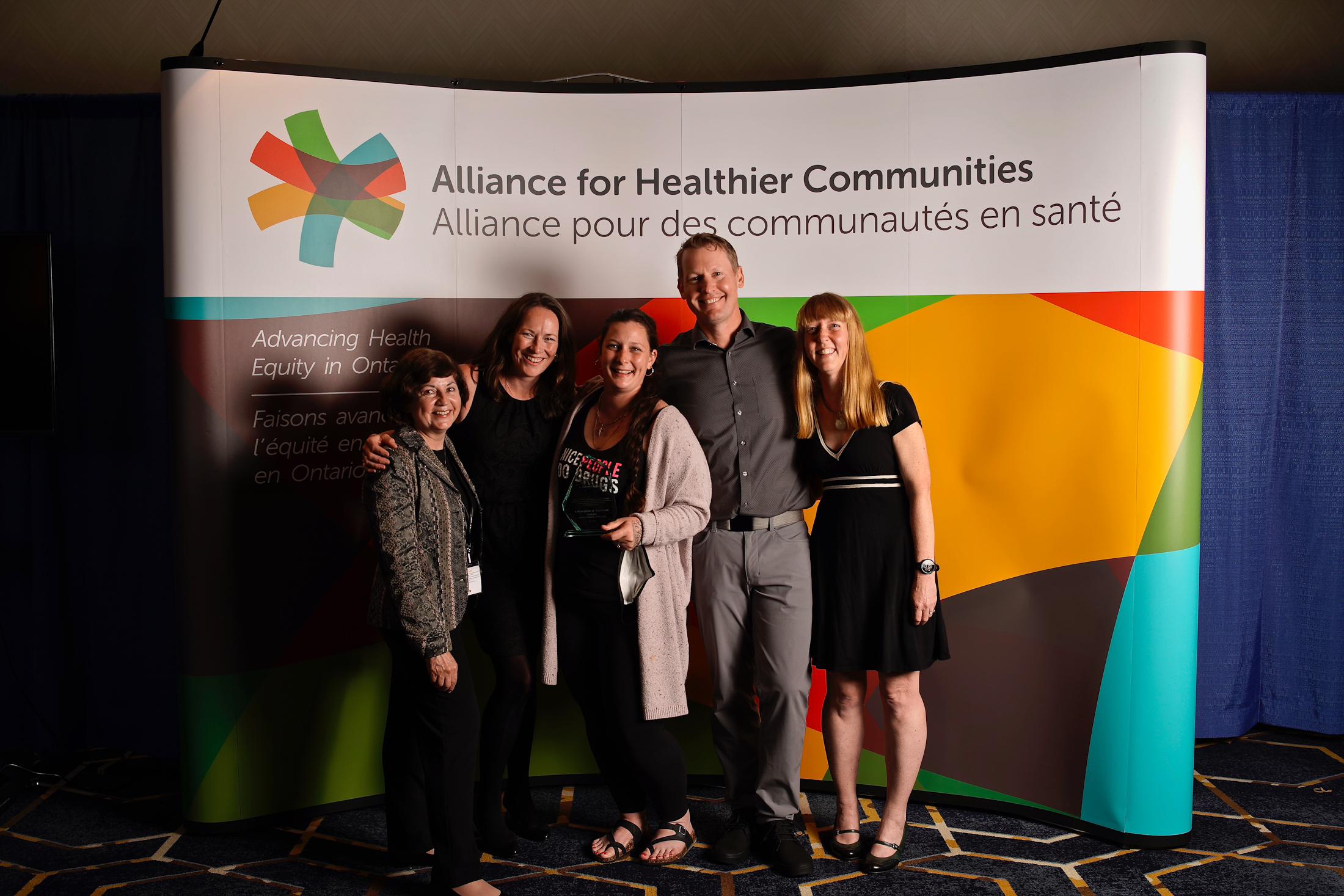 Staff from Kingston CHC Consumption and Treatment Services accept Transformative Change Award 2022