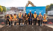 Staff and current and former board members celebrate the groundbreaking of the new location of Hamilton Urban Core CHC, along with the Mayor of Hamilton and Sarah Hobbs, CEO, Alliance for Healthier Communities.